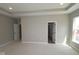 Bedroom with two doors, carpet, neutral walls and base trim at 4075 Persian St, Greenwood, IN 46143
