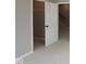 View of closet and entry to stairs with carpet flooring and neutral walls at 4075 Persian St, Greenwood, IN 46143