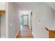 Inviting entryway with hardwood floors and neutral paint leads to the front door at 4075 Persian St, Greenwood, IN 46143