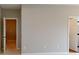 Neutral hallway features white trim and leads to bedrooms at 4075 Persian St, Greenwood, IN 46143
