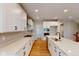 Modern kitchen featuring white cabinets, stainless appliances, and a quartz island at 4075 Persian St, Greenwood, IN 46143
