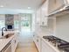 Bright, modern kitchen featuring white cabinets, stainless steel appliances, and quartz countertops at 4075 Persian St, Greenwood, IN 46143