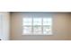 Bright living room features a large window with views of the surrounding neighborhood and water at 4075 Persian St, Greenwood, IN 46143