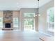 Bright, open living room featuring a stone fireplace, high ceilings, and natural light at 4075 Persian St, Greenwood, IN 46143