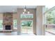 Bright and airy living room with a stone fireplace and a sliding glass door leading to a deck at 4075 Persian St, Greenwood, IN 46143