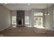 Spacious living room featuring a stone fireplace and sliding doors, bathed in natural light at 4075 Persian St, Greenwood, IN 46143