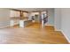 Open-concept living area showcasing a kitchen island with an adjoining living room and staircase at 4075 Persian St, Greenwood, IN 46143