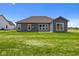 Exterior showcasing backyard and grey siding at 4076 Berry Chase Blvd, Greenwood, IN 46143