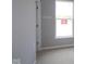 Bedroom with neutral walls, carpeted flooring, and large window offering natural light to the room at 4076 Berry Chase Blvd, Greenwood, IN 46143