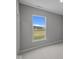 Bedroom with neutral color walls and large window with green space views at 4076 Berry Chase Blvd, Greenwood, IN 46143