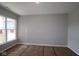 Bedroom with neutral walls, carpeted flooring, and large window offering natural light to the room at 4076 Berry Chase Blvd, Greenwood, IN 46143