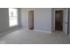 Bedroom with neutral walls, carpeted flooring, with a window and a closet door, very well illuminated at 4076 Berry Chase Blvd, Greenwood, IN 46143