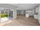 Bright open living area with kitchen, dining and a view to the backyard at 4076 Berry Chase Blvd, Greenwood, IN 46143