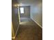 Bedroom with gray carpeting, freshly painted walls, and natural light from a window at 41 S Warman Ave, Indianapolis, IN 46222