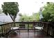 Charming back porch with seating and view of the trees at 4644 N Ritter Ave, Indianapolis, IN 46226