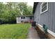 Cozy backyard with green grass and adjacent storage shed at 4644 N Ritter Ave, Indianapolis, IN 46226