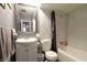 A simple bathroom with a tub, toilet, and a sink at 4644 N Ritter Ave, Indianapolis, IN 46226