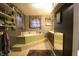 Bathroom view with a jacuzzi-style bathtub and a double sink vanity at 4644 N Ritter Ave, Indianapolis, IN 46226