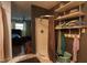 Bathroom view displaying the shower stall, storage shelves, and bedroom doorway at 4644 N Ritter Ave, Indianapolis, IN 46226