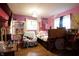 Bright bedroom with hardwood floors and a unique decor at 4644 N Ritter Ave, Indianapolis, IN 46226