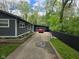 Shows the side exterior of the home, with a long driveway leading to a garage and backyard at 4644 N Ritter Ave, Indianapolis, IN 46226