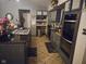 Well-organized kitchen with granite countertops, modern appliances and tile backsplash at 4644 N Ritter Ave, Indianapolis, IN 46226