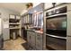Updated kitchen featuring stainless steel appliances and a mosaic tile backsplash at 4644 N Ritter Ave, Indianapolis, IN 46226