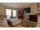 Comfortable living room featuring lots of natural light and a decorative fireplace at 4644 N Ritter Ave, Indianapolis, IN 46226