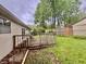 Wooden deck in home's backyard surrounded by lush greenery at 4718 Tempe Ct, Indianapolis, IN 46241