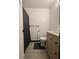 Bathroom with a toilet, vanity, and a dark shower curtain at 4718 Tempe Ct, Indianapolis, IN 46241