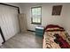 Bright bedroom with a window, closet, wooden armoire, and a patterned twin bed at 4718 Tempe Ct, Indianapolis, IN 46241