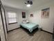 Bright bedroom with a window, ceiling fan, a twin bed, and colorful decorations at 4718 Tempe Ct, Indianapolis, IN 46241
