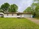 Charming single-story home with a well-maintained lawn and a two-car garage at 4718 Tempe Ct, Indianapolis, IN 46241