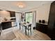 A view of the kitchen's eating area with a sliding glass door leading to the back yard at 4718 Tempe Ct, Indianapolis, IN 46241