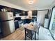 Modern kitchen with stainless steel appliances and a wooden table at 4718 Tempe Ct, Indianapolis, IN 46241