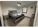 This bedroom features neutral walls, and a ceiling fan at 4718 Tempe Ct, Indianapolis, IN 46241