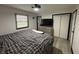 This bedroom features neutral walls, and a double closet at 4718 Tempe Ct, Indianapolis, IN 46241