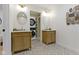 Modern bathroom showcases double sinks, marble countertops, and convenient stackable washer/dryer at 4725 Boulevard Pl, Indianapolis, IN 46208