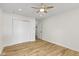 Bedroom with a ceiling fan, hardwood floors, and a double-door closet for ample storage at 4725 Boulevard Pl, Indianapolis, IN 46208