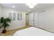 Clean bedroom features neutral walls, wood-look flooring, and an abstract canvas at 4725 Boulevard Pl, Indianapolis, IN 46208