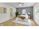Cozy bedroom with neutral tones, hardwood floors, and an en suite bathroom featuring a walk-in shower at 4725 Boulevard Pl, Indianapolis, IN 46208