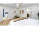 Bright bedroom with hardwood floors and decorative accents provides views of a recently remodeled kitchen at 4725 Boulevard Pl, Indianapolis, IN 46208