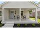Charming front porch with seating, offering a cozy and inviting outdoor space at 4725 Boulevard Pl, Indianapolis, IN 46208