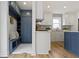 Newly renovated kitchen with white cabinets, stainless steel appliances, and a blue accent island at 4725 Boulevard Pl, Indianapolis, IN 46208
