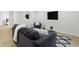 The basement living room is furnished with a plush couch and stylish decor at 4725 Boulevard Pl, Indianapolis, IN 46208