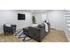 Finished basement living room boasts an airy feel with a couch, decor, and bright lighting at 4725 Boulevard Pl, Indianapolis, IN 46208