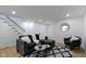 Cozy finished basement living room area features a comfortable couch and stylish decor at 4725 Boulevard Pl, Indianapolis, IN 46208