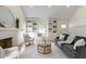 Well-lit living room with built-in shelving, a cozy seating area, and stylish decor at 4725 Boulevard Pl, Indianapolis, IN 46208