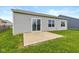 Backyard featuring a patio and a grassy area, perfect for outdoor activities at 4752 Chip Shot Ln, Indianapolis, IN 46235