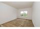 Bright, spacious bedroom with neutral carpeting, a window overlooking the backyard, and ample space at 4752 Chip Shot Ln, Indianapolis, IN 46235